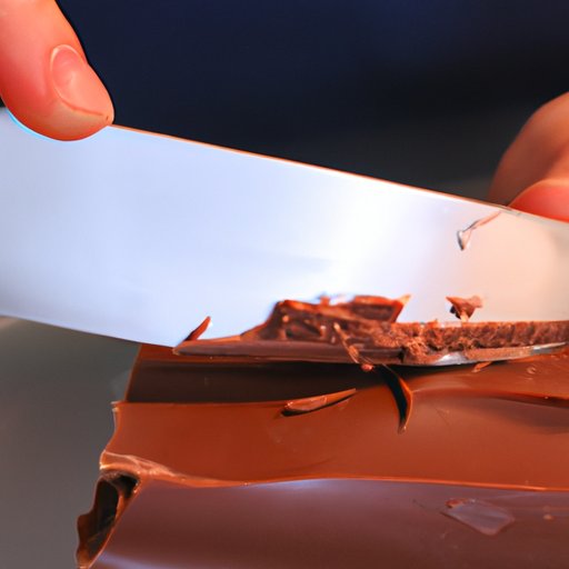 Using a Butter Knife to Scrape Away the Chocolate