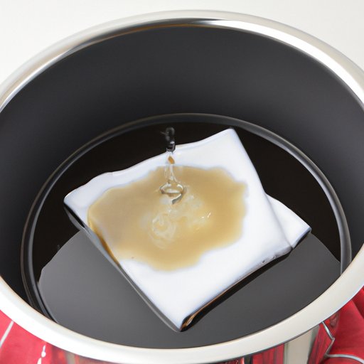 Solution 3: Boil a mixture of water and vinegar in a pot and use a cloth to wipe away the grease afterwards